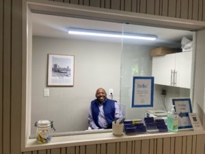 Tony Wall at the check-in area at AIM: Advaita Integrated Medicine in Raleigh, North Carolina.