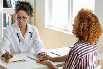 Female doctor listening to patient explaining
